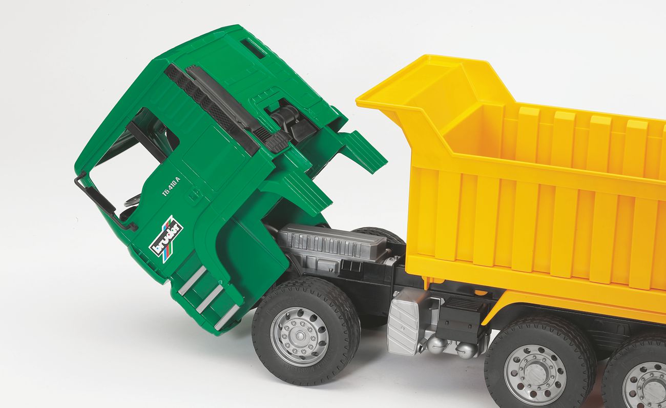 Bruder Man TGA dump truck toy vehicle with realistic details, yellow cab, and open-bed cargo area for children.