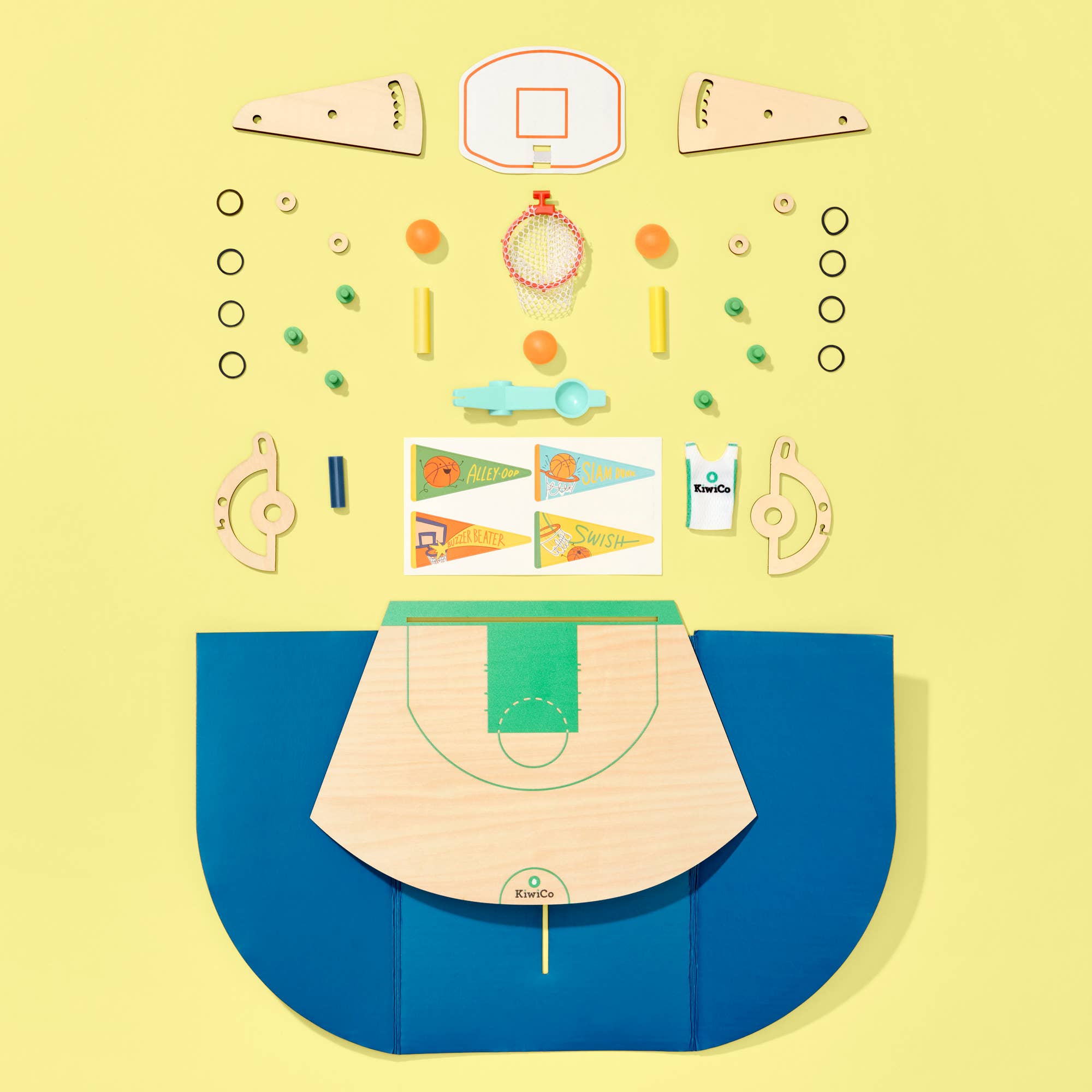 DIY basketball catapult kit by KiwiCo featuring colorful components and assembled catapult ready for STEM-based play.