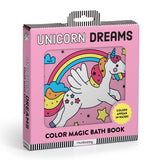 Baby enjoying the Unicorn Dreams Color Magic Bath Book by Mudpuppy with colorful unicorn illustrations in the bath.