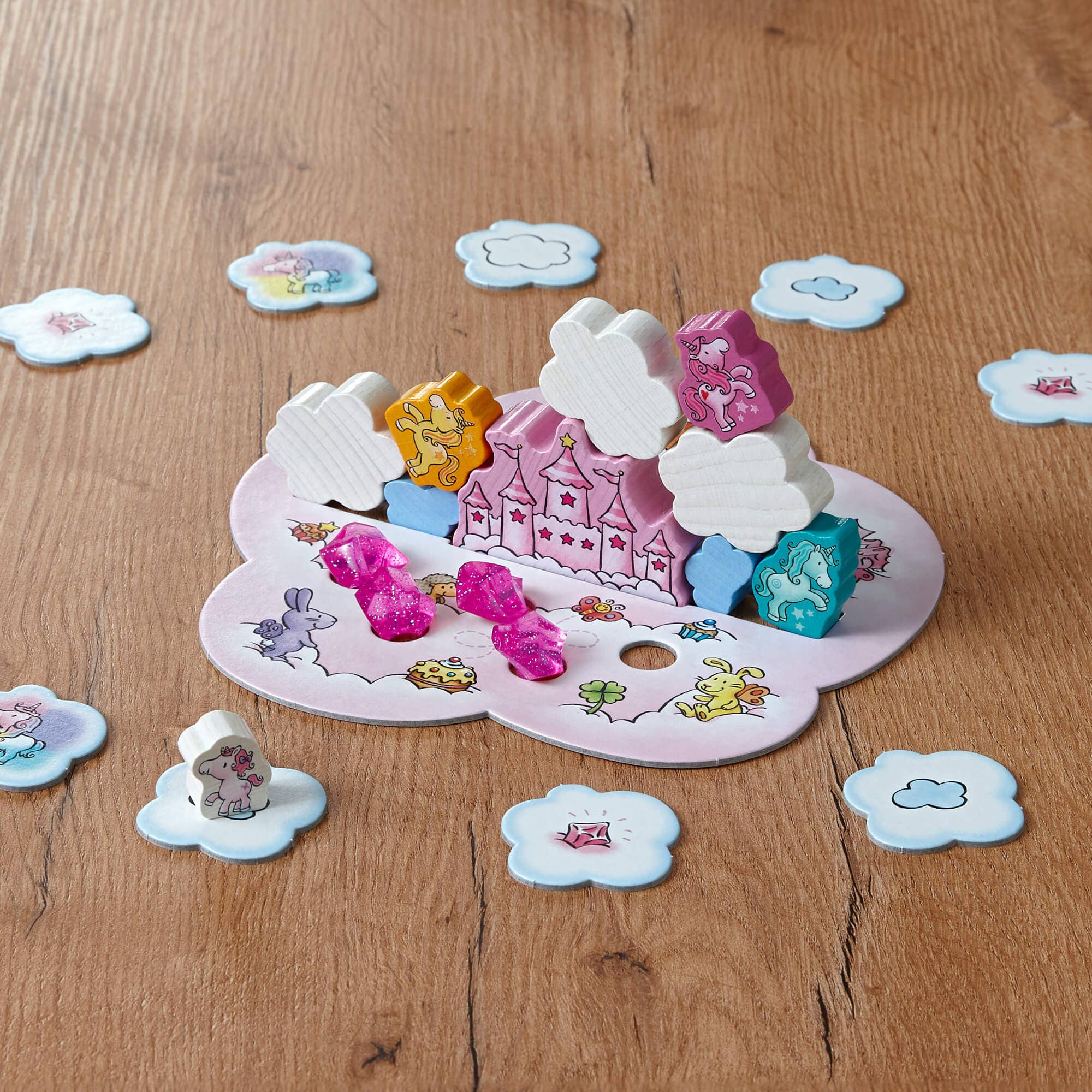HABA USA Unicorn Glitterluck Cloud stacking game with colorful cloud-shaped pieces for children’s fun and imaginative play.