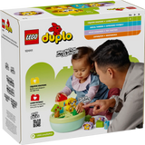 LEGO DUPLO shape sorter building set featuring a puppy house with colorful blocks and a smiling puppy figure for young children.