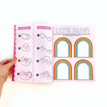 Draw-Along Rainbow Sticker Book by Pipsticks featuring colorful sticker pages and fun rainbow-themed illustrations for kids.