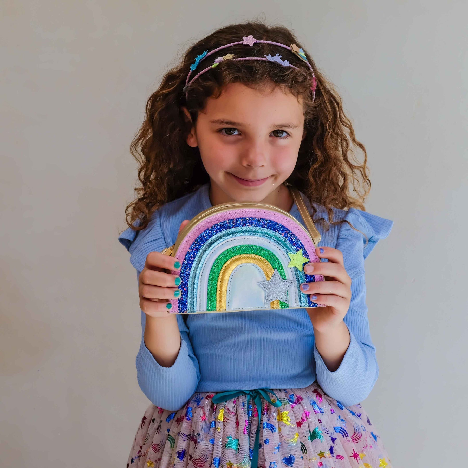 Kids glitter rainbow purse by Mimi & Lula featuring a colorful rainbow design and shiny glitter accents.