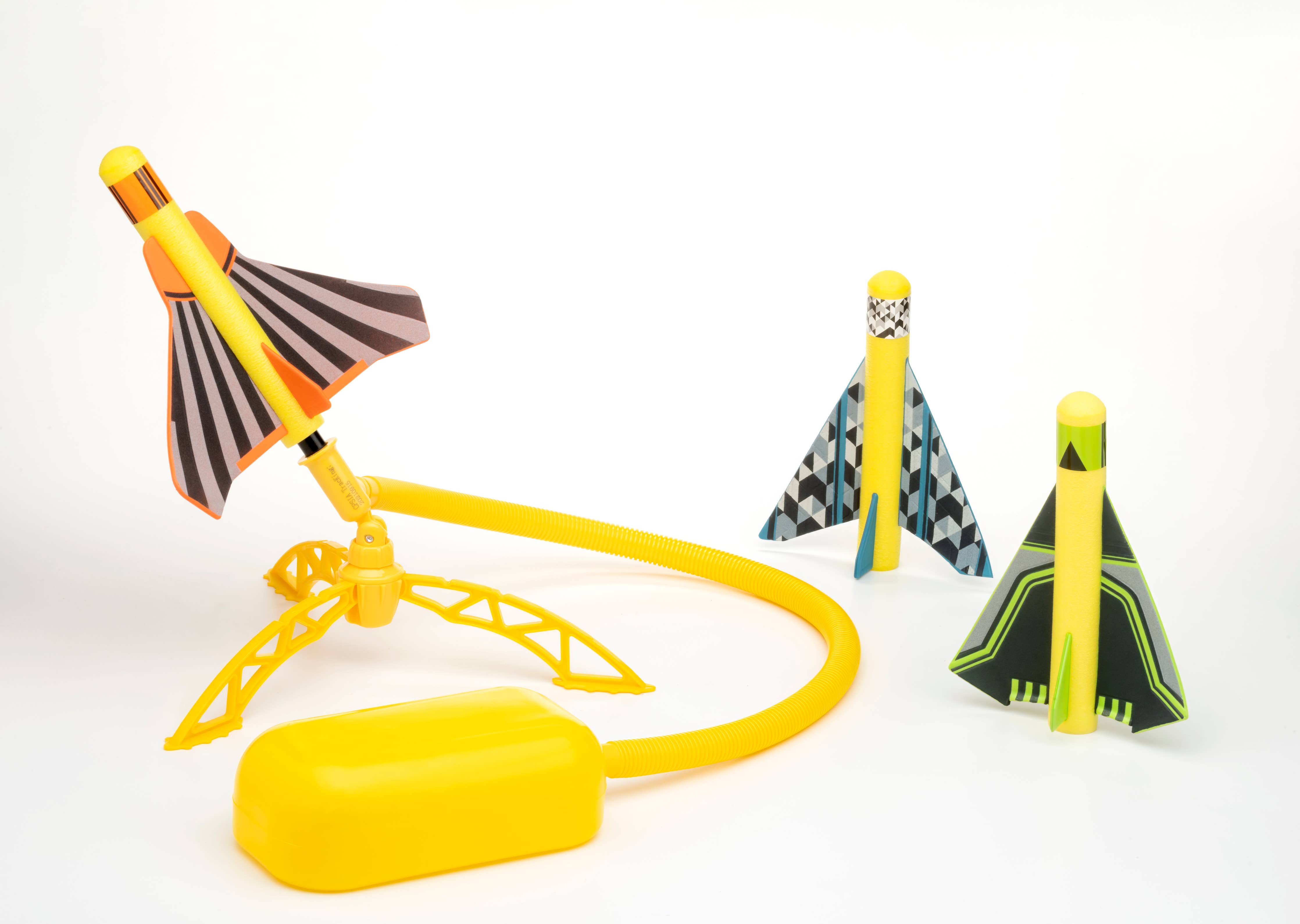 Stomp Rocket Stunt Planes outdoors, colorful foam planes ready for launching and stunt flying in the yard.