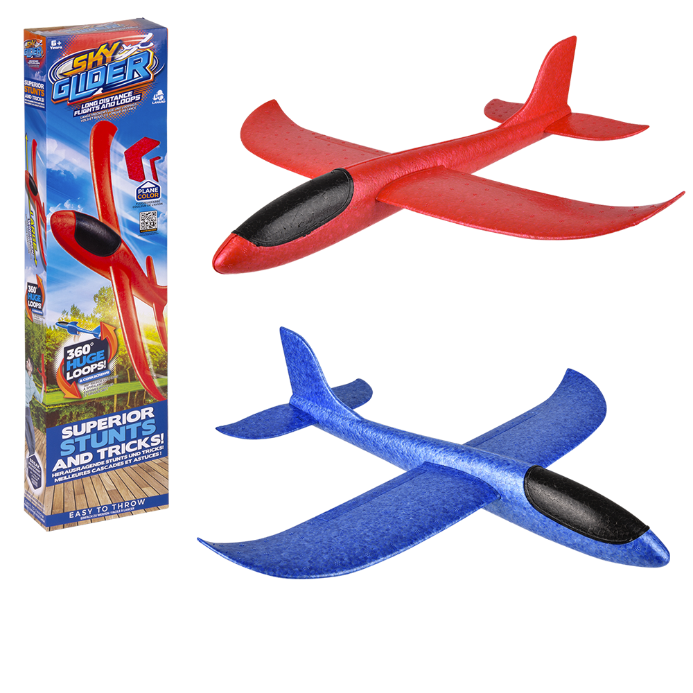 Colorful Stunt Flyer Sky Glider outdoor toy by The Toy Network flying through the sky against a blue background.