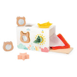 Baby playing with Janod sensory shape sorter, colorful educational toy with various shaped blocks for early learning and sensory development.