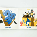 Baby reading the Animal Opposites Board Book by Simon & Schuster, featuring colorful animal illustrations and simple opposites.