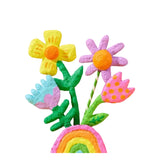 Colorful felt flowers and rainbow on a white background