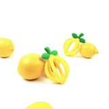 Itzy Ritzy baby lemon teething ball with textured surface for soothing gums and sensory play.