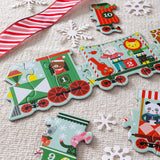 Children's train-themed puzzle with numbered car pieces on a textured surface with snowflakes and candy cane.