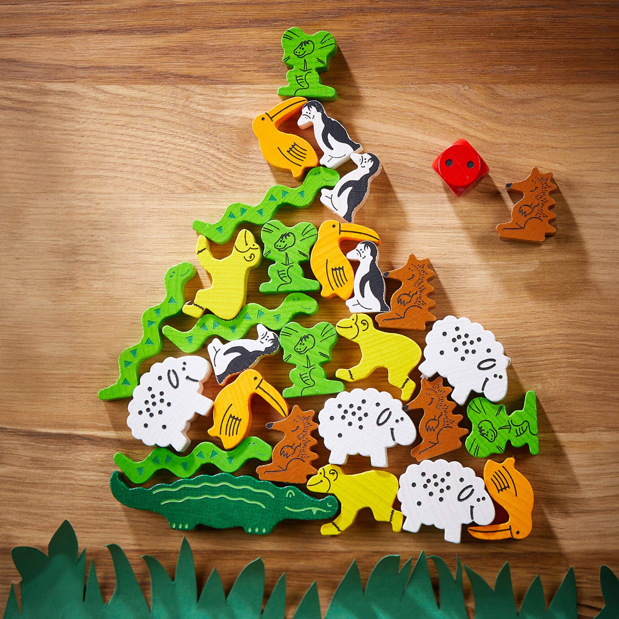 HABA USA Animal Upon Animal game with colorful wooden animals stacked on a game board, designed for children’s stacking fun.