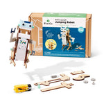 Colorful jumping robot built with KiwiCo STEAM robotics and building kit, featuring gears, wires, and a smiling face.