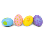 Wooden egg shakers toy set by Jack Rabbit Creations, showing colorful small percussion instruments for children.