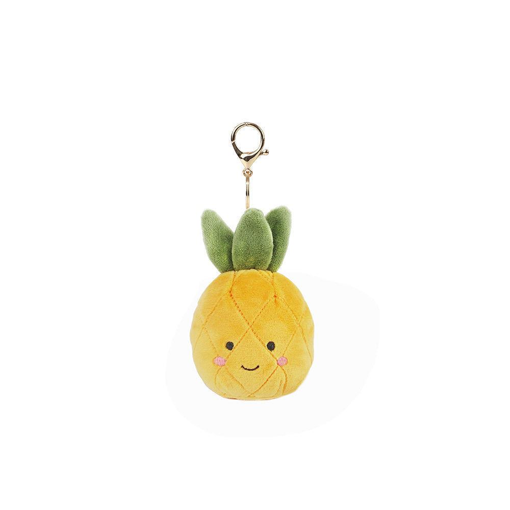 Soft pineapple plush bag charm by Mon Ami, featuring bright yellow fabric and a cute, detailed embroidered face.