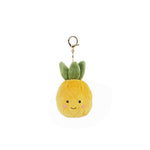 Soft pineapple plush bag charm by Mon Ami, featuring bright yellow fabric and a cute, detailed embroidered face.