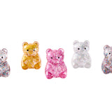 J'adore Glitter Bear Squishy sensory toy with glittery surface and soft, squeezable texture for stress relief and sensory play.