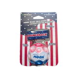 Waboba Stars & Stripes Bounceback Moon Ball outdoors, featuring red, white, and blue stars and stripes design for active play.