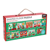 Box of a shaped floor puzzle featuring a Christmas train design on a white background.