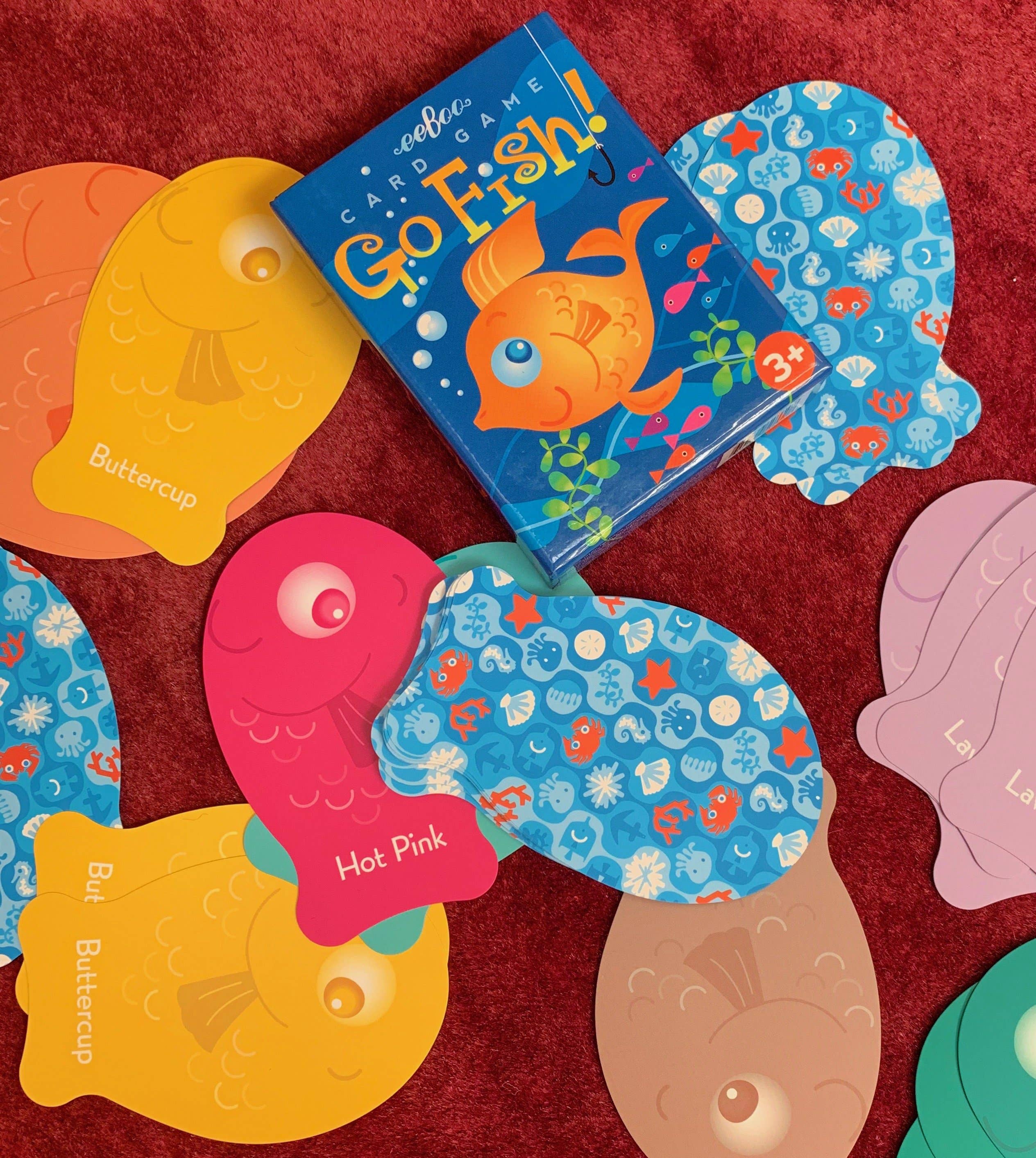 Color Go Fish Card Game by eeBoo showing a deck of colorful illustrated fish-themed playing cards spread out on a surface.