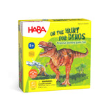 HABA USA On the Hunt for Dinos memory game with colorful dinosaur cards spread out on a table.