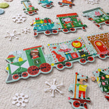 Children's train puzzle with colorful train car pieces on a textured surface.