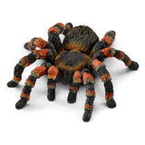 Schleich tarantula spider animal toy figurine with detailed black and brown body, realistic textured legs, on a white background.