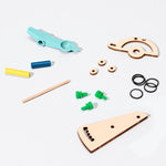 DIY basketball catapult kit by KiwiCo Inc., showing the assembled STEAM-based educational toy with colorful components and a small basketball.