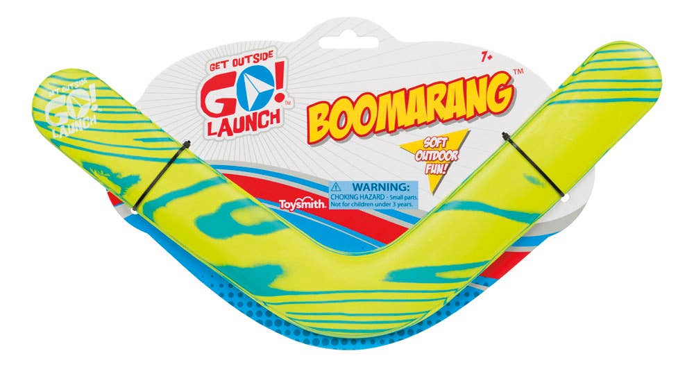 Toysmith outdoor boomerang shown in mid-flight against a clear sky, showcasing its colorful design and aerodynamic shape.