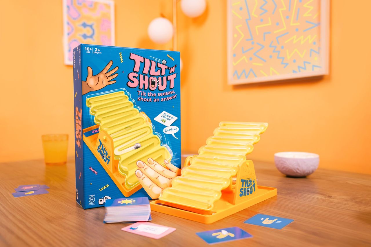Tilt & Shout game by Big Potato Games featuring colorful game pieces and a game board for family fun and interactive play.
