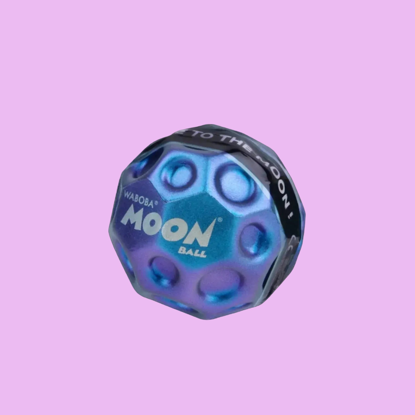 Waboba Metallic Moon Ball outdoors, blue metallic surface, designed for outdoor play and bouncing fun.